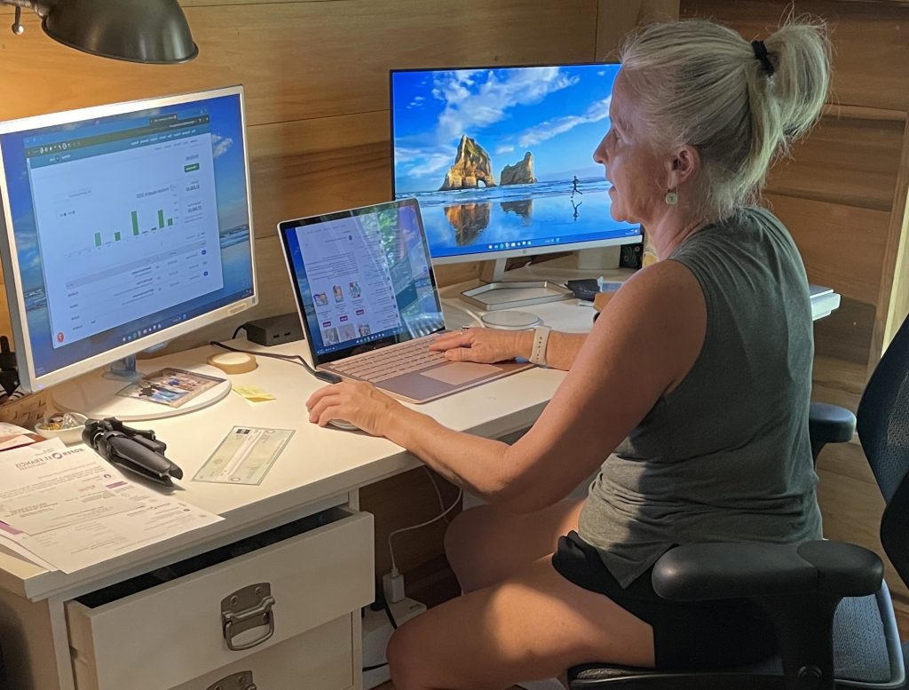 Lucy sitting at desk working on the current website build.